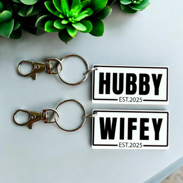 Hubby and Wifey Key Rings
Personalised Key Rings
Acrylic Key Rings
Newlywed Gifts
Custom Key Rings
Established Year Key Rings
Wedding Gifts
Anniversary Gifts
Relationship Keepsakes
Made to Order Key Rings
Unique Couple Gifts
Love and Commitment
Sydney Crafted
Key Ring Set for Couples