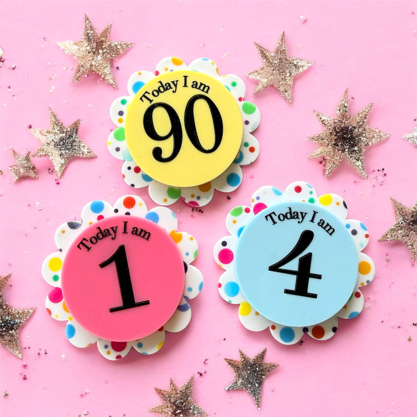 Colorful birthday age badges on a pink background with decorative stars.