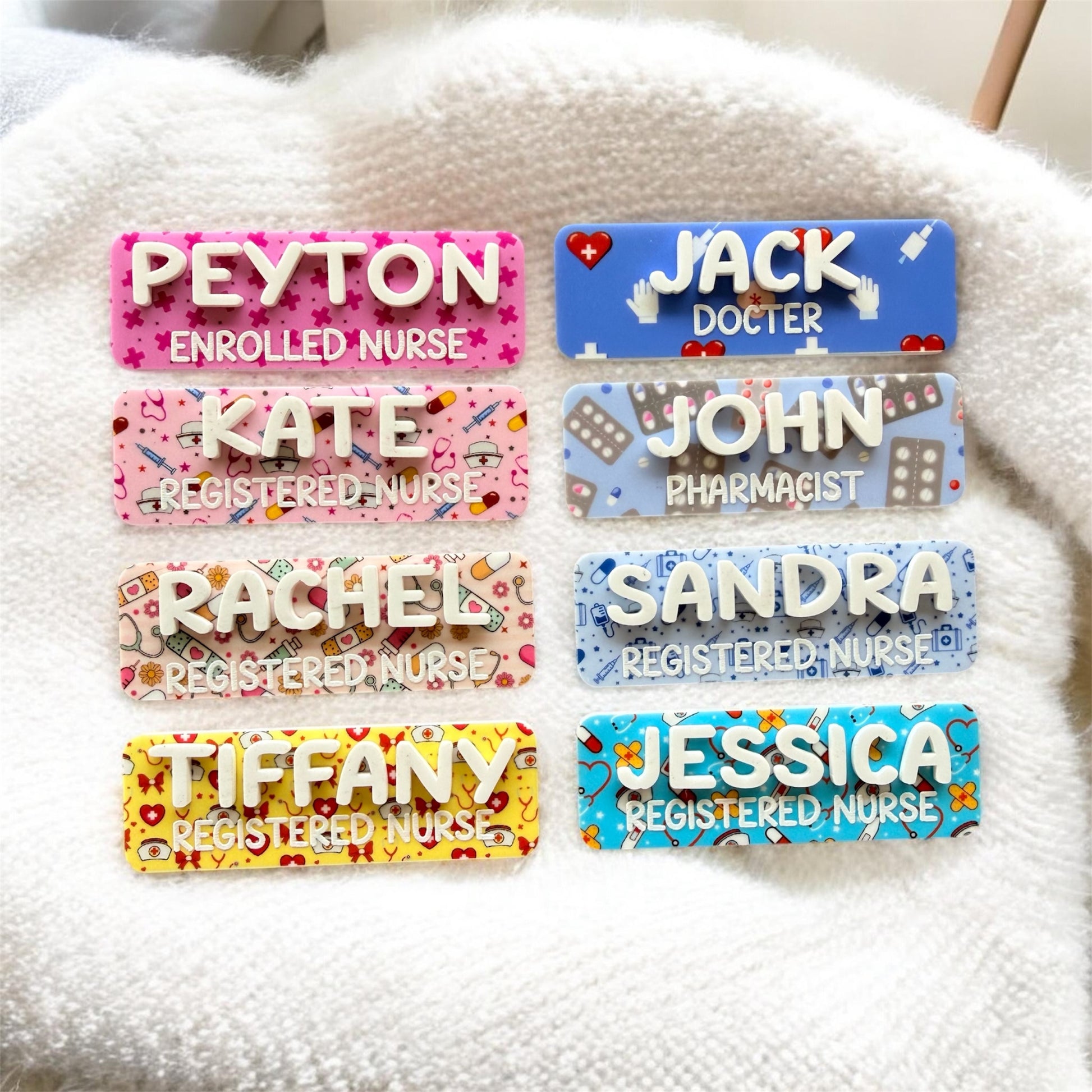 Colorful name badges with various professions on a textured surface